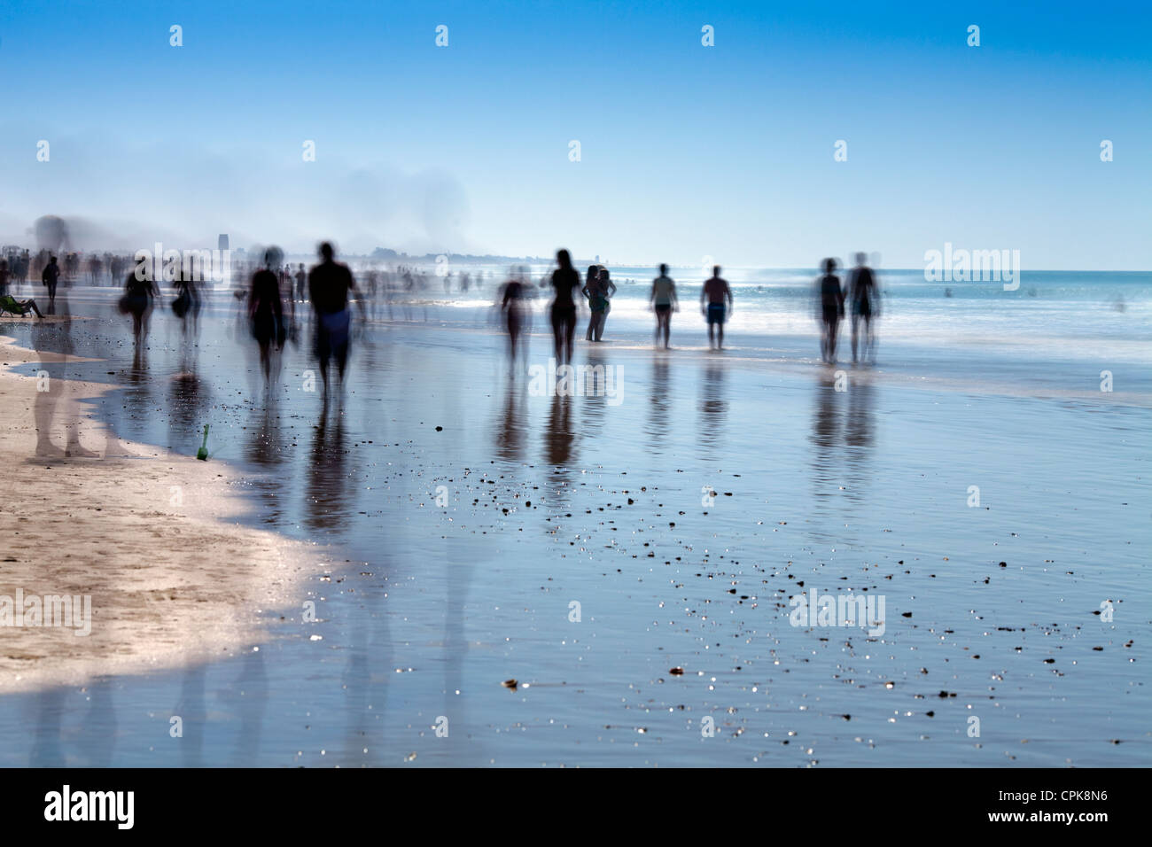 People on the beach. Daylight long exposure shot by the use of neutral
