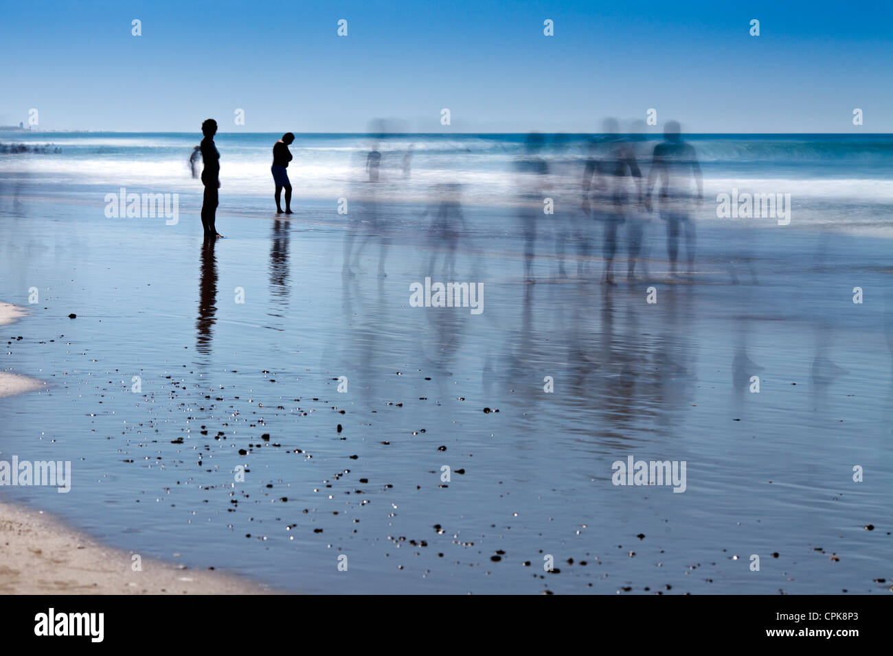 People on the beach. Daylight long exposure shot by the use of neutral