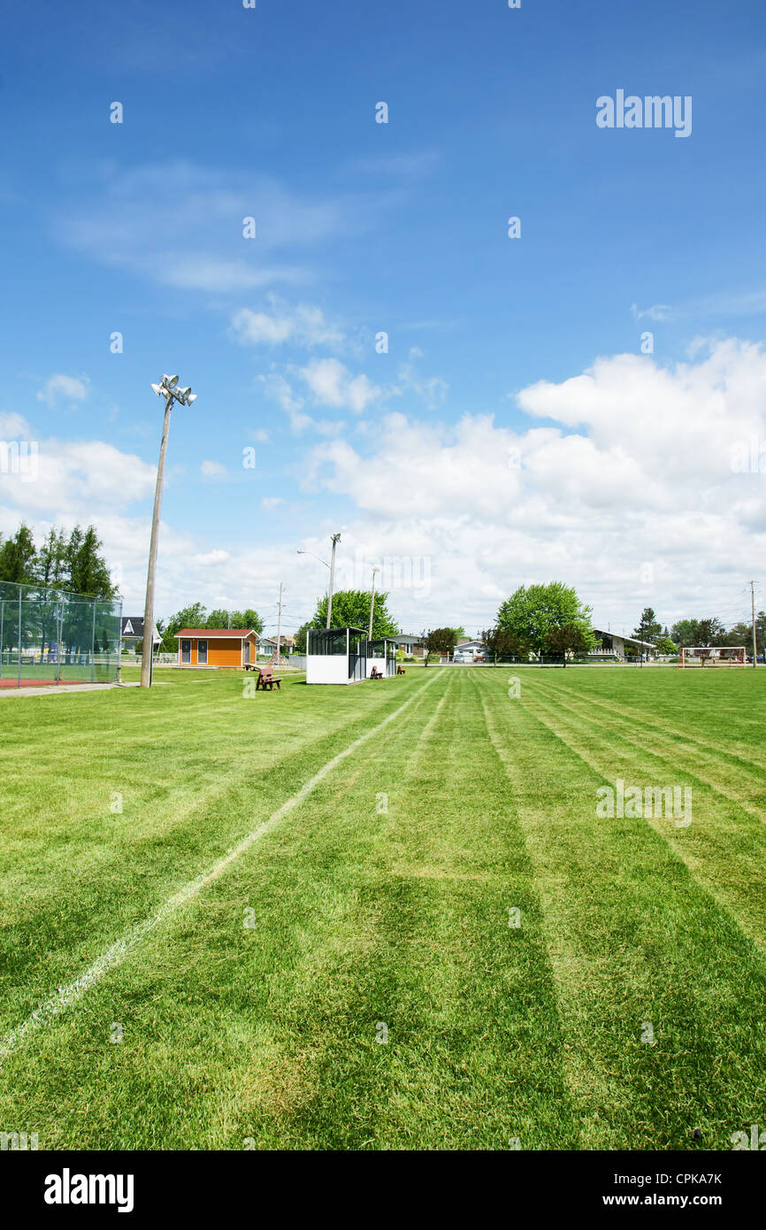 View from the corner of a soccer or football field with dug outs and