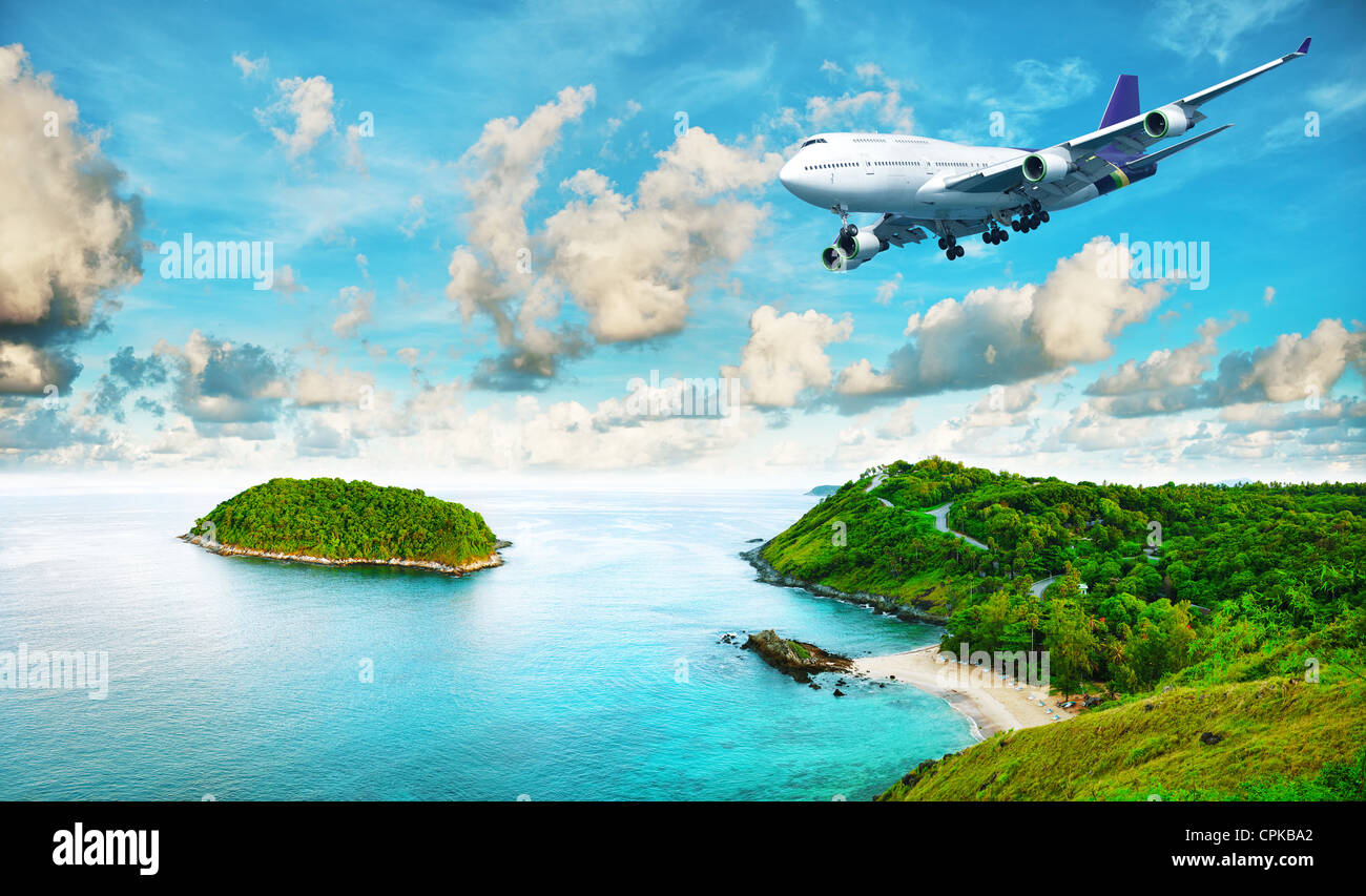 Jet liner over the tropical island. Panoramic composition in very high resolution. HDR processed. Stock Photo