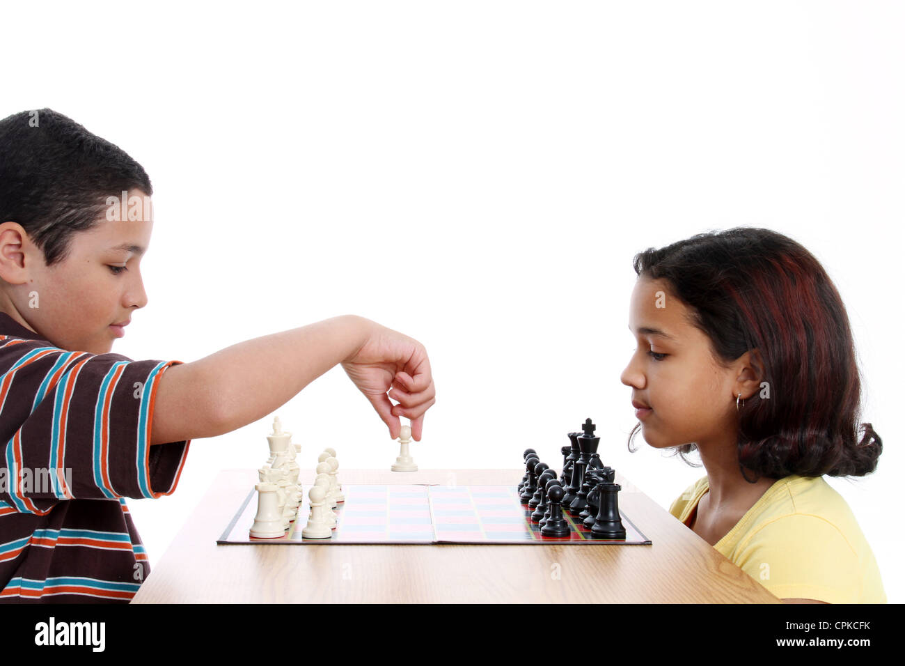 Picture of children playing chess set on white background Stock Photo