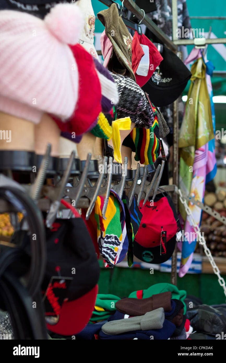 hats in street market Brixton Stock Photo