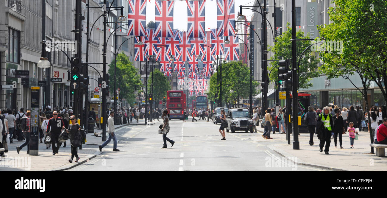 Pedestrians in Oxford Street with Jubilee Union Jacks which may also be in place during 2012