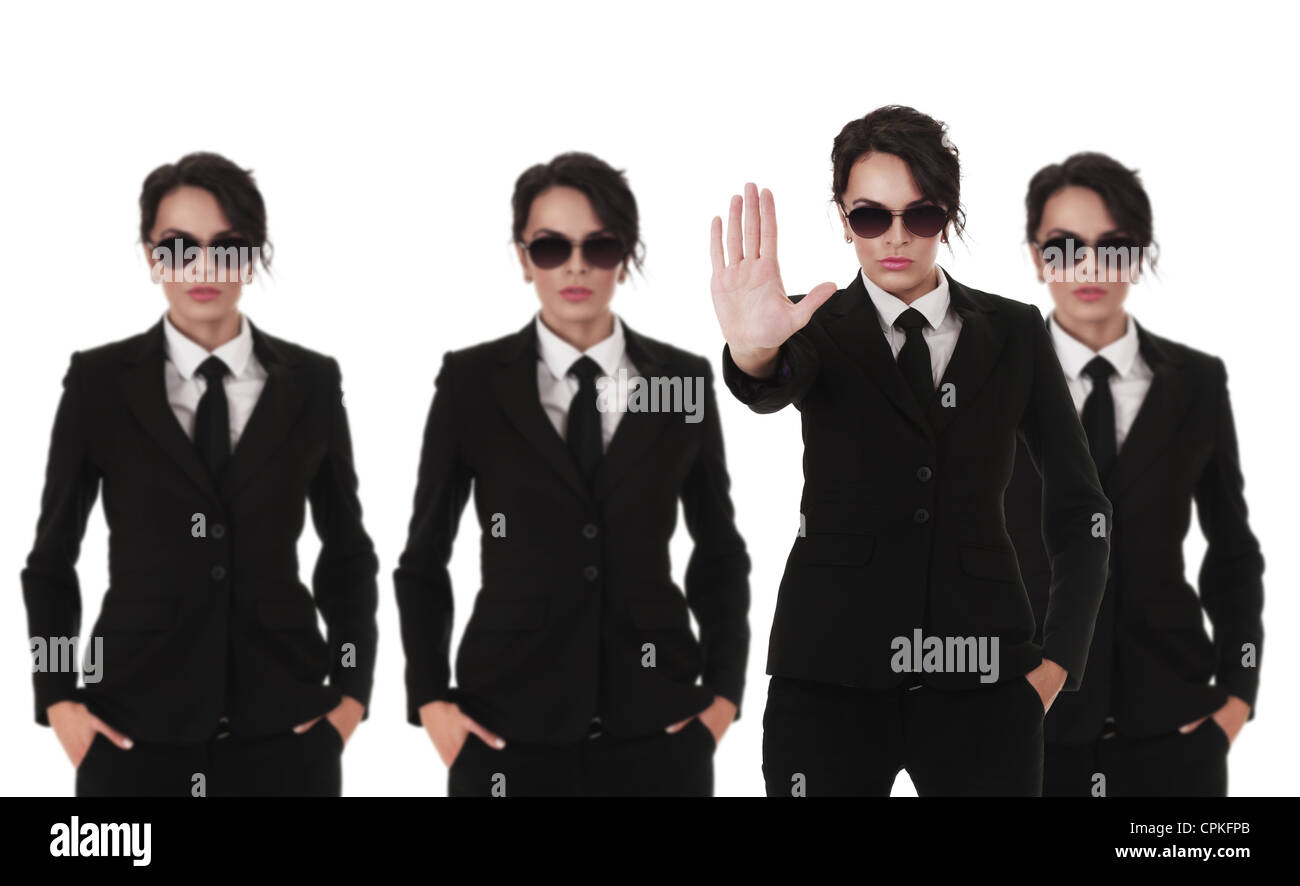 Group of young secret service agents or police officers isolated over white background Stock Photo