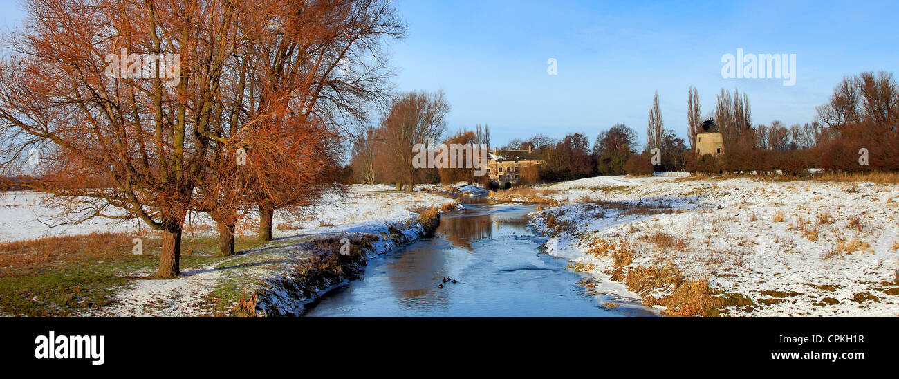 A frosty, snowy winter scene over the river Nene at Castor village, Cambridgeshire, England; Britain; UK Stock Photo