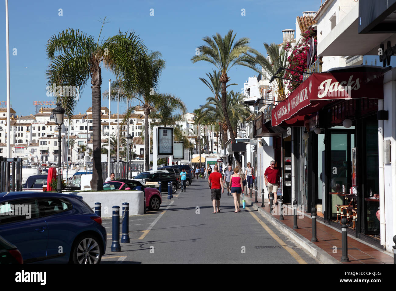 Shopping center in Puerto Banus, a marina near Marbella, Andalusia. Several  street vendors expect to sell your goods Stock Photo - Alamy