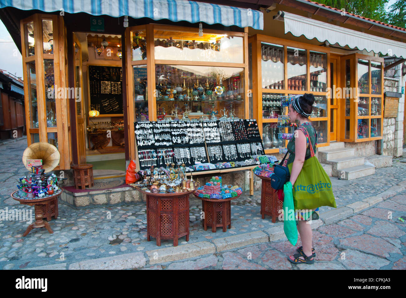 Souvenir shopping at Sebilj the Pigeon square Baščaršija the Turkish Quarter central Sarajevo city Bosnia and Herzegovina Europe Stock Photo