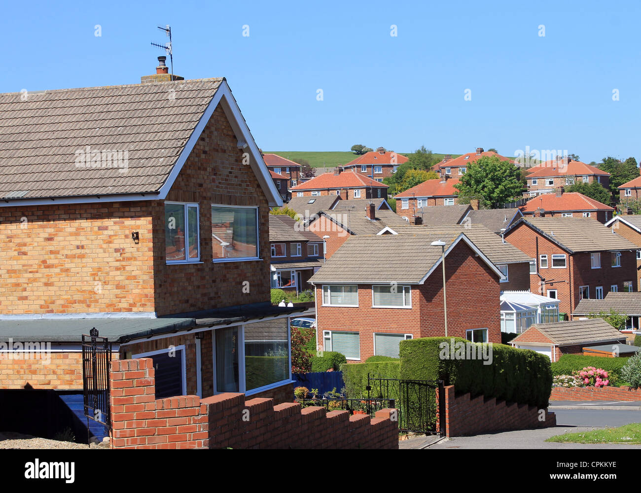 English housing estate with blue sky background. Stock Photo