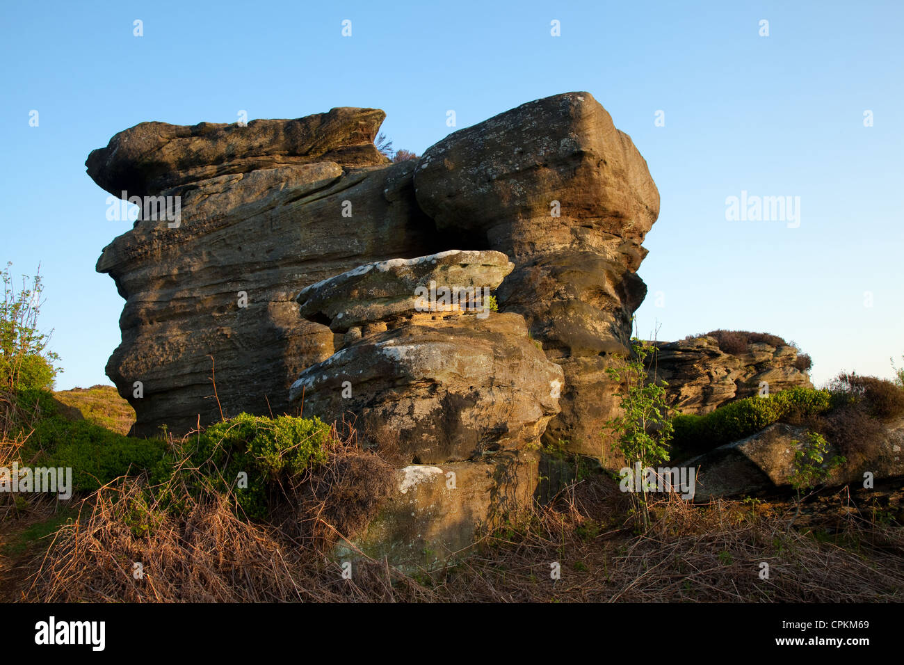 Brimham Rocks balancing natural rock formations in North Yorkshire Dales,  Active kids and visiting tourists at the National Trust Site with holidayin Stock Photo