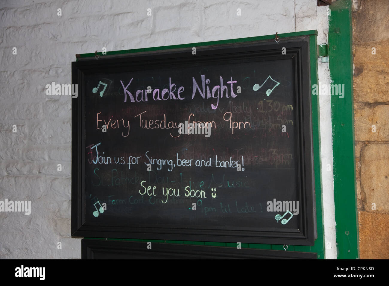 Sign on pub wall advertising Karaoke Night Stock Photo