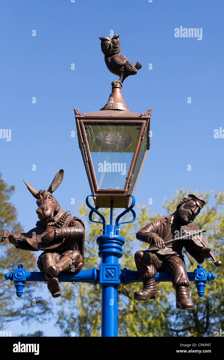 Lamp-post in Stratford upon Avon depicting Bottom, an Owl and a traditional Jewish fiddler. Stock Photo
