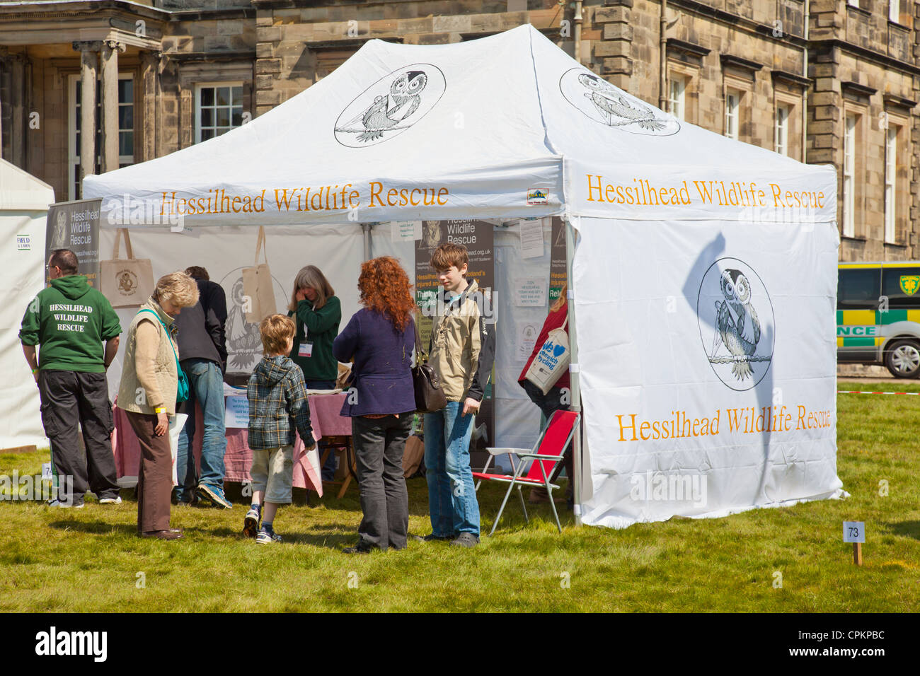 Staff and volunteers from Hessilhead Wildlife Rescue engaging with visitors to the Scottish Bird Fair at Hopetoun House. Stock Photo