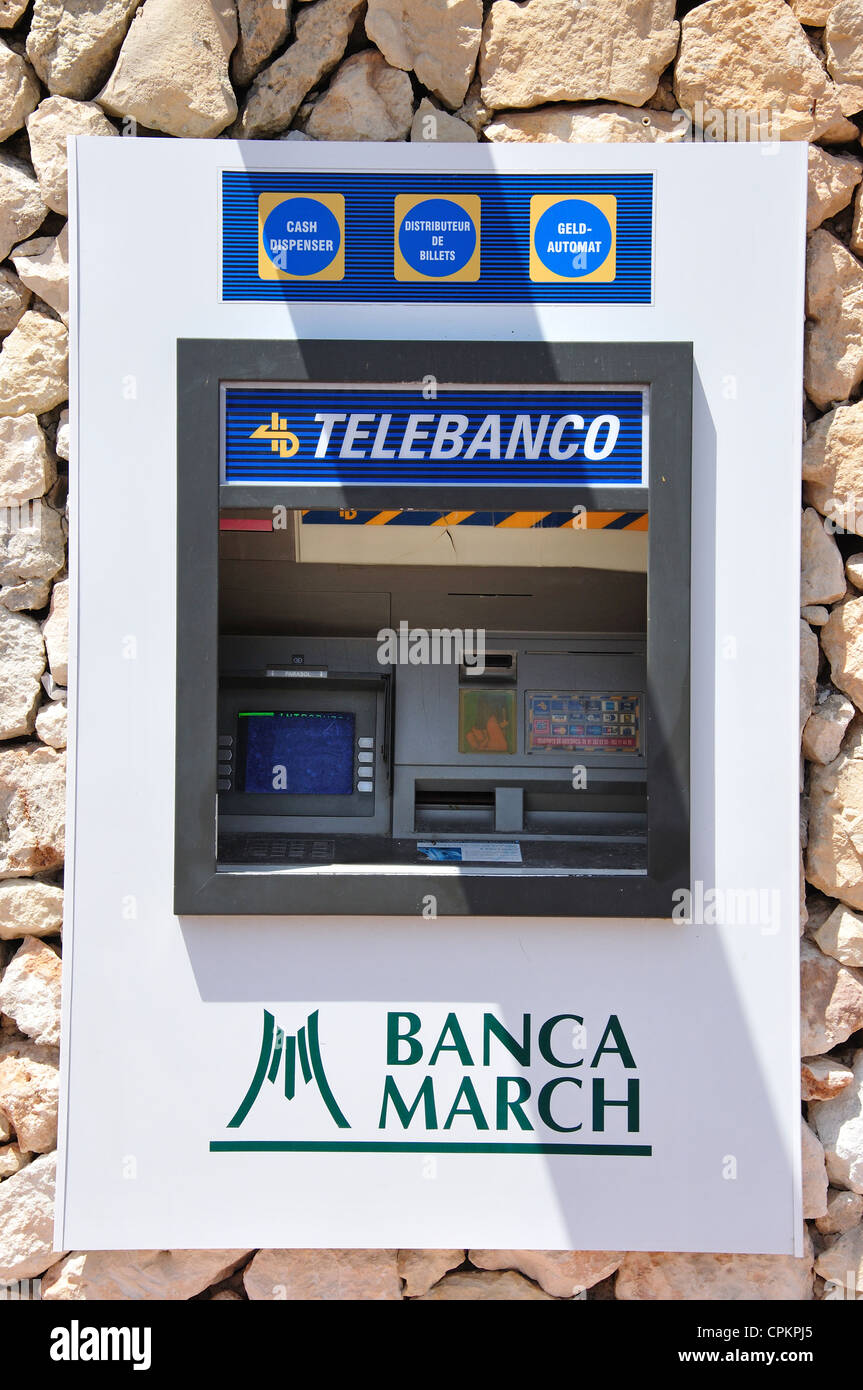 Blanca March ATM machine on Passeig del Riu, Cala Santa Galdana, Menorca, Balearic Islands, Spain Stock Photo