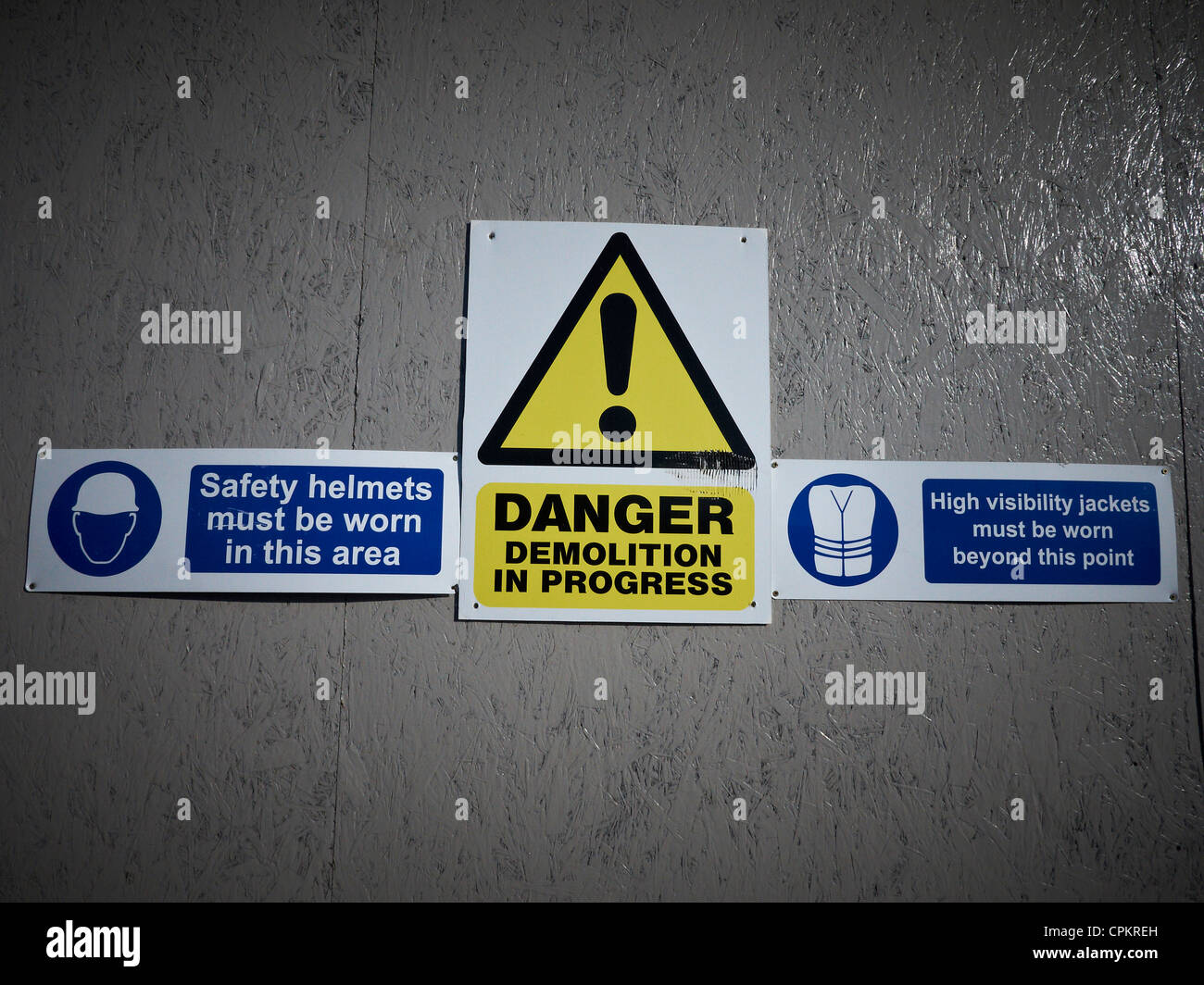 Health and safety signs on building site fence Stock Photo
