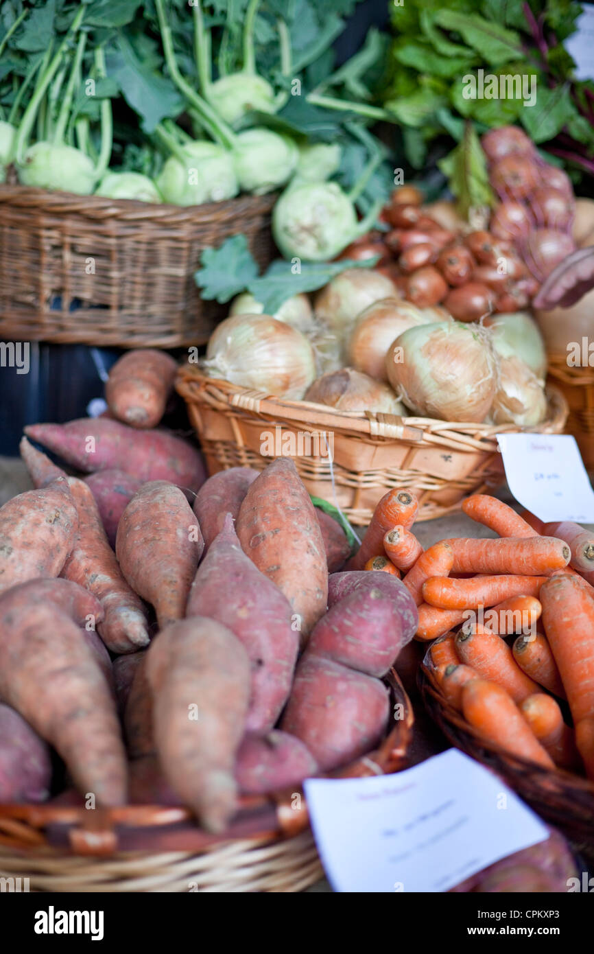 Organic vegetables for sale in baskets. Stock Photo