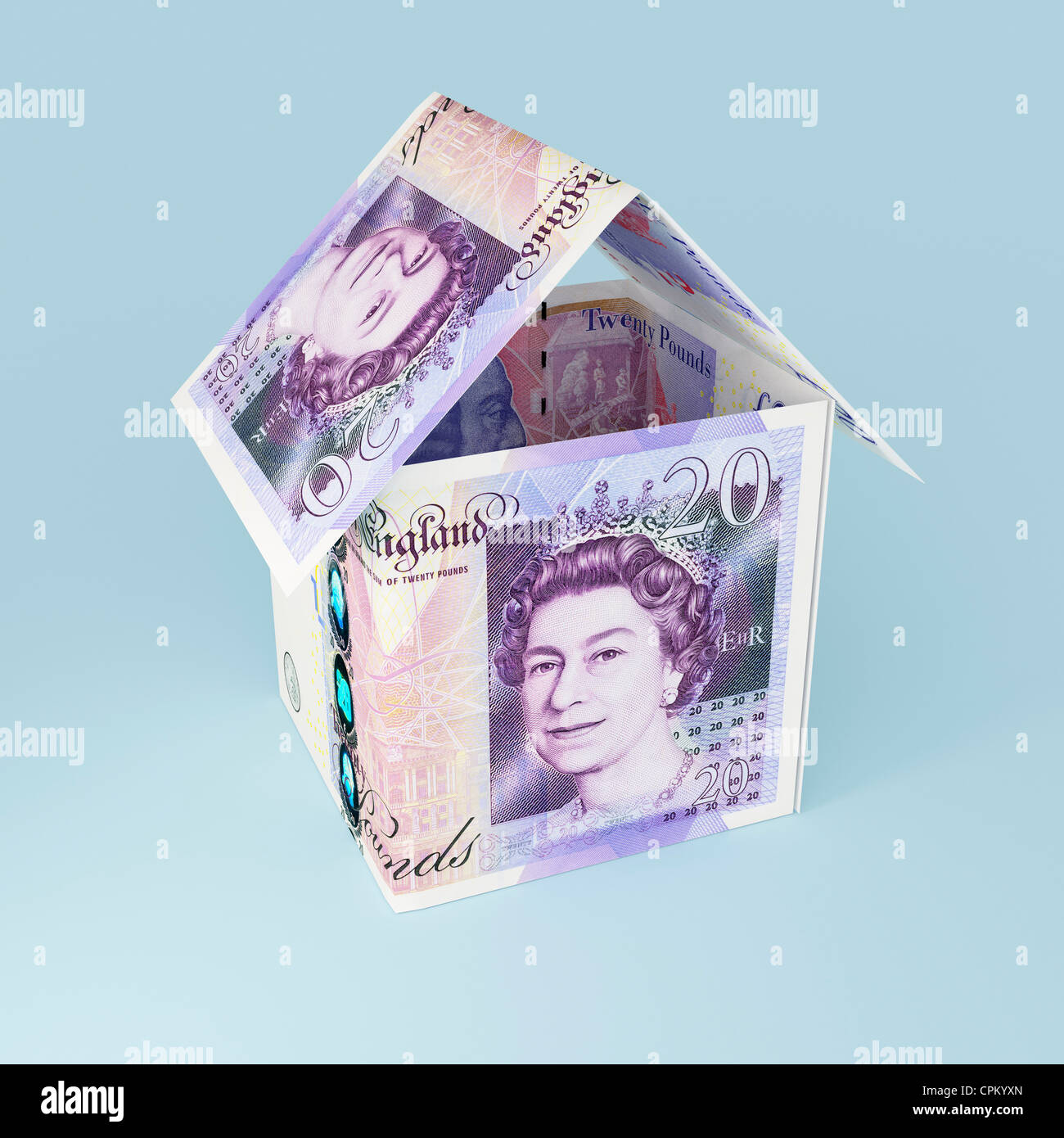 Money house made with twenty pound notes sterling Stock Photo