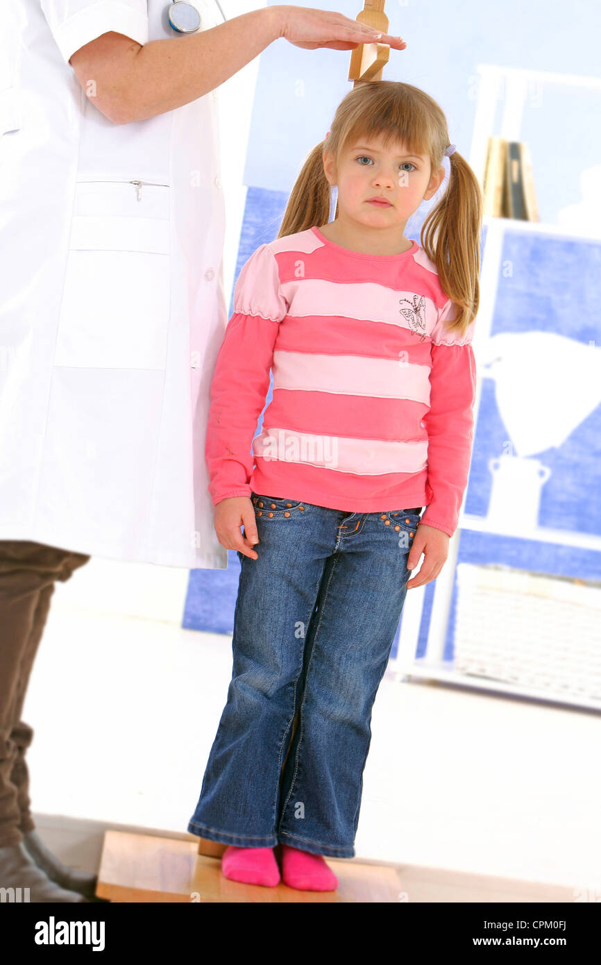 MEASURING HEIGHT IN A CHILD Stock Photo