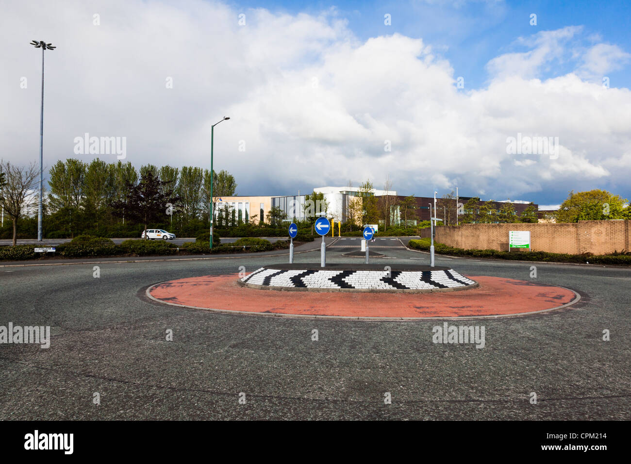 Entrance to West Lancashire College with roundabout and blue sky