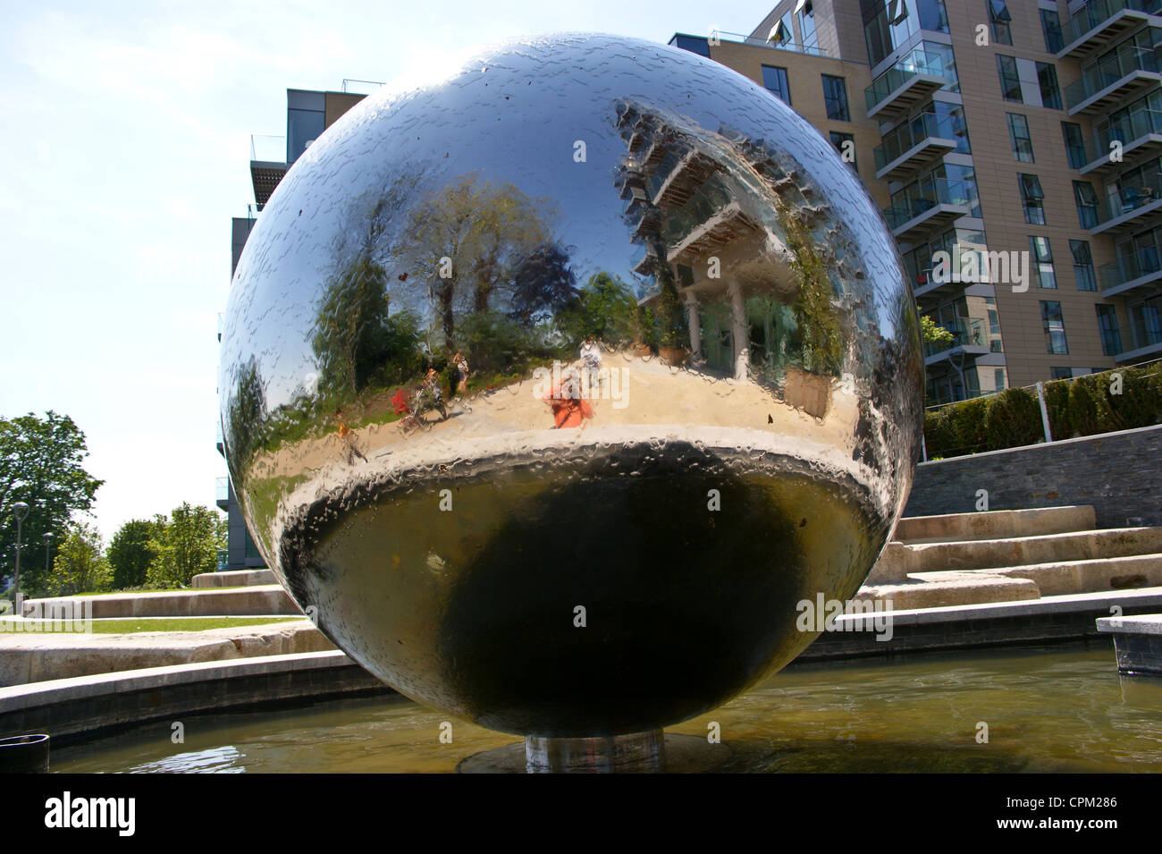 A mirror ball waterfall sculpture, Berkeley Homes Woodberry Down, New River Path, Haringey