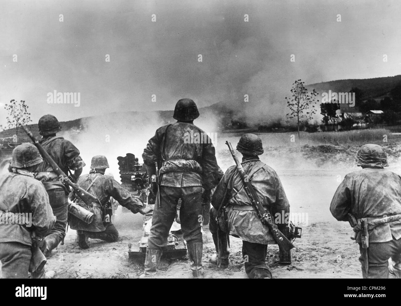 Soldiers of the Waffen-SS bombards partisans in a village, 1941 Stock Photo