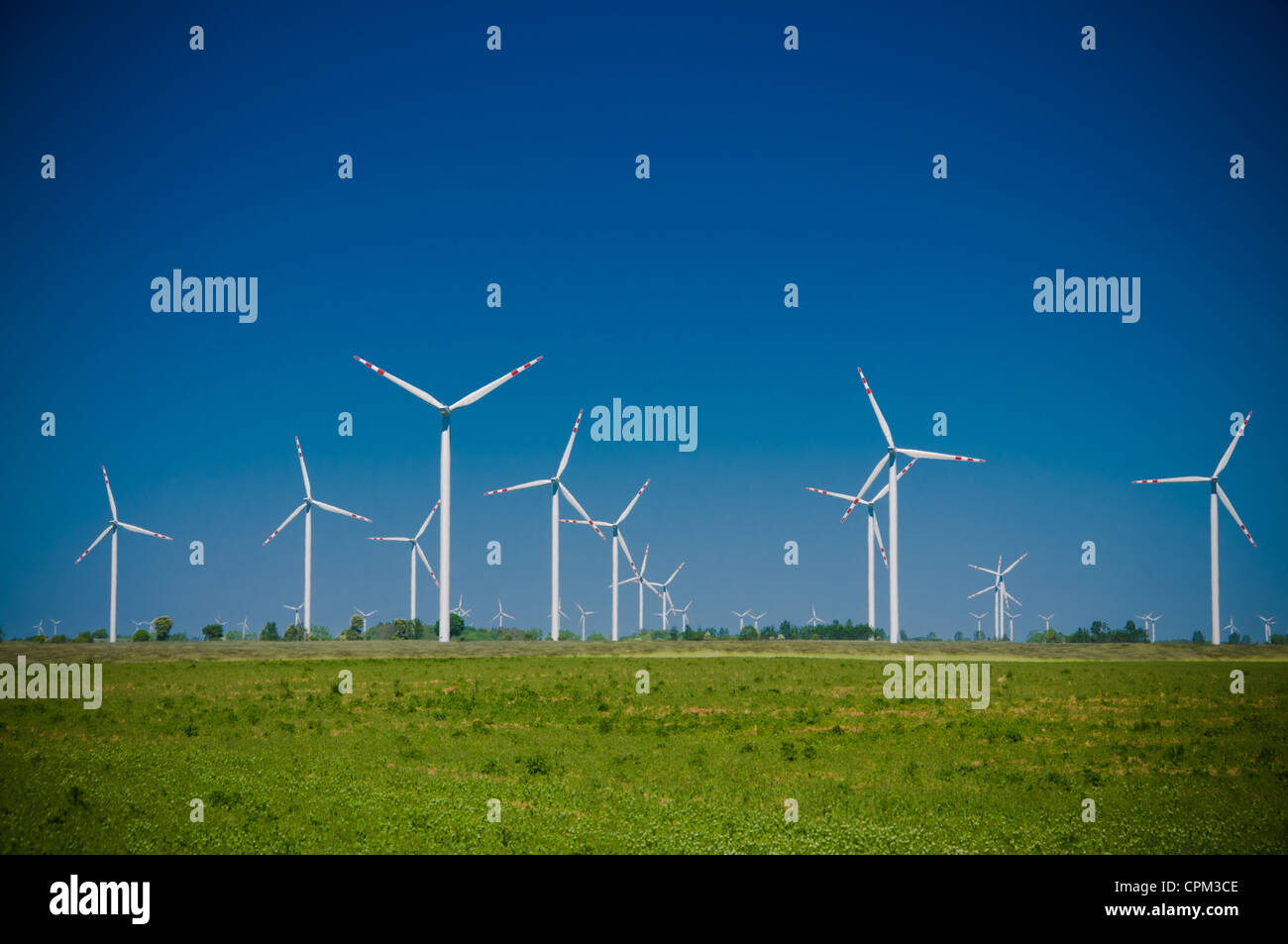 Wind turbine farm on rural terrain Stock Photo - Alamy