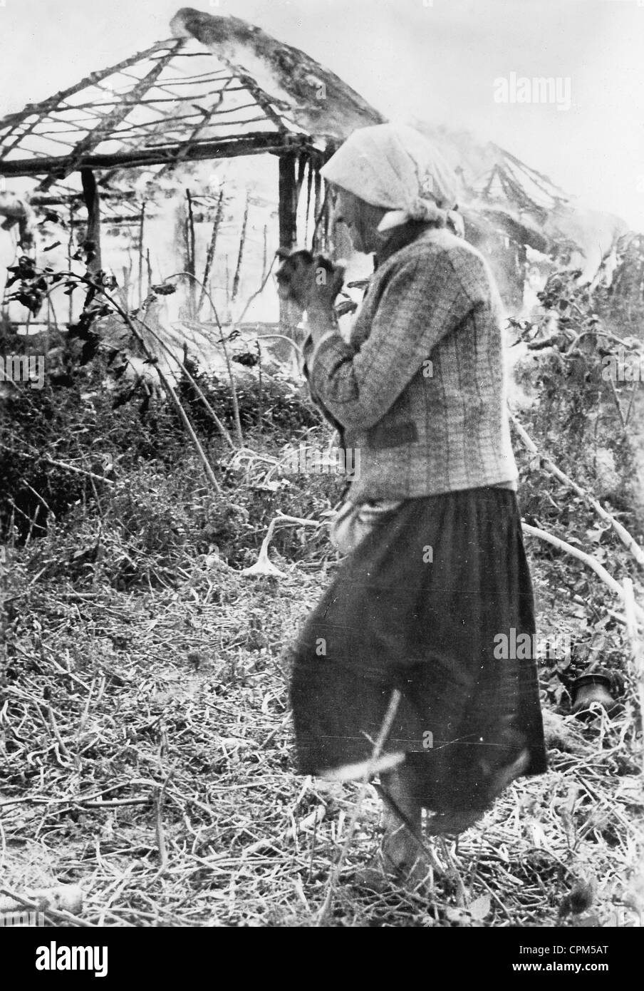 Russian woman in a ruined village on the Eastern Front, 1941 Stock Photo