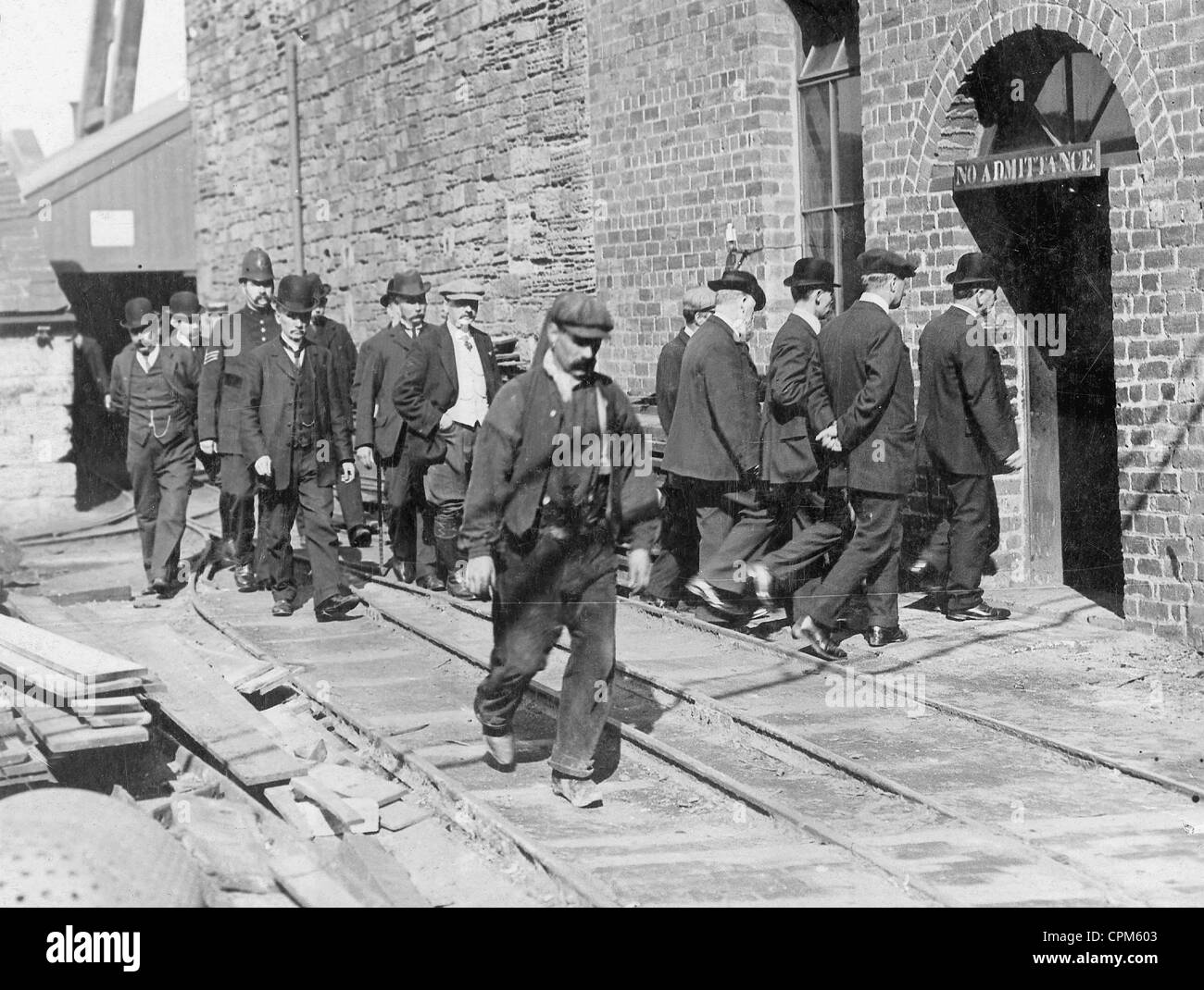 Workers go to work during a strike in England, 1910 Stock Photo