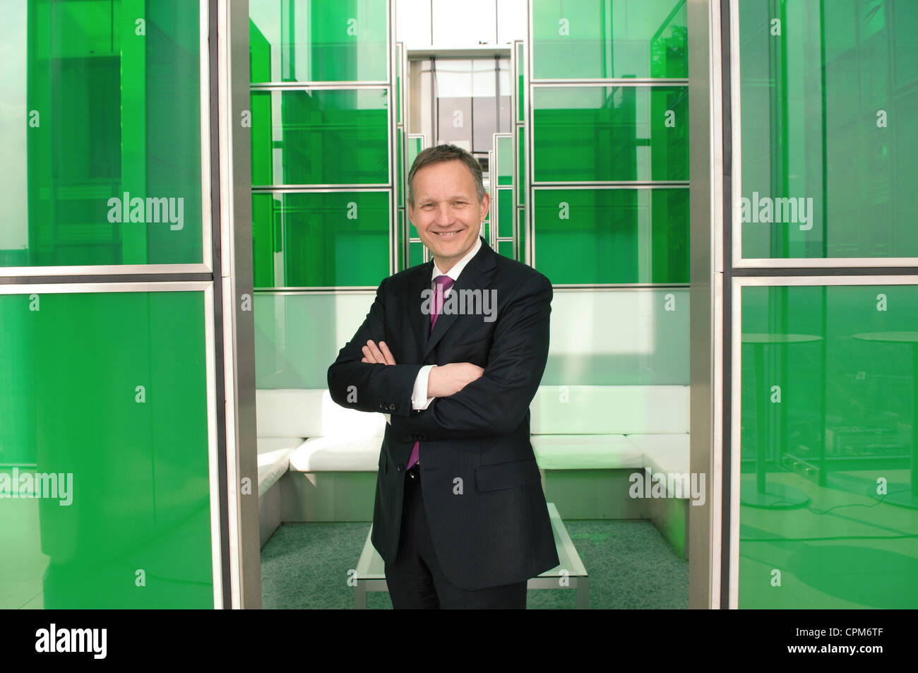 Barclays Chief Executive  Antony Jenkins Bank Barclays bank CEO green meeting room green glass folded arms Stock Photo