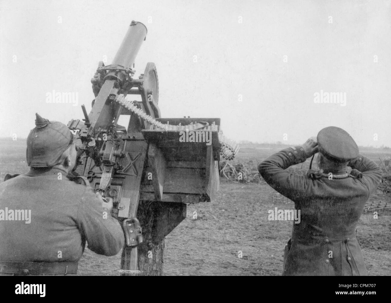 German soldiers with a machine gun performing air defense in WWI Stock Photo