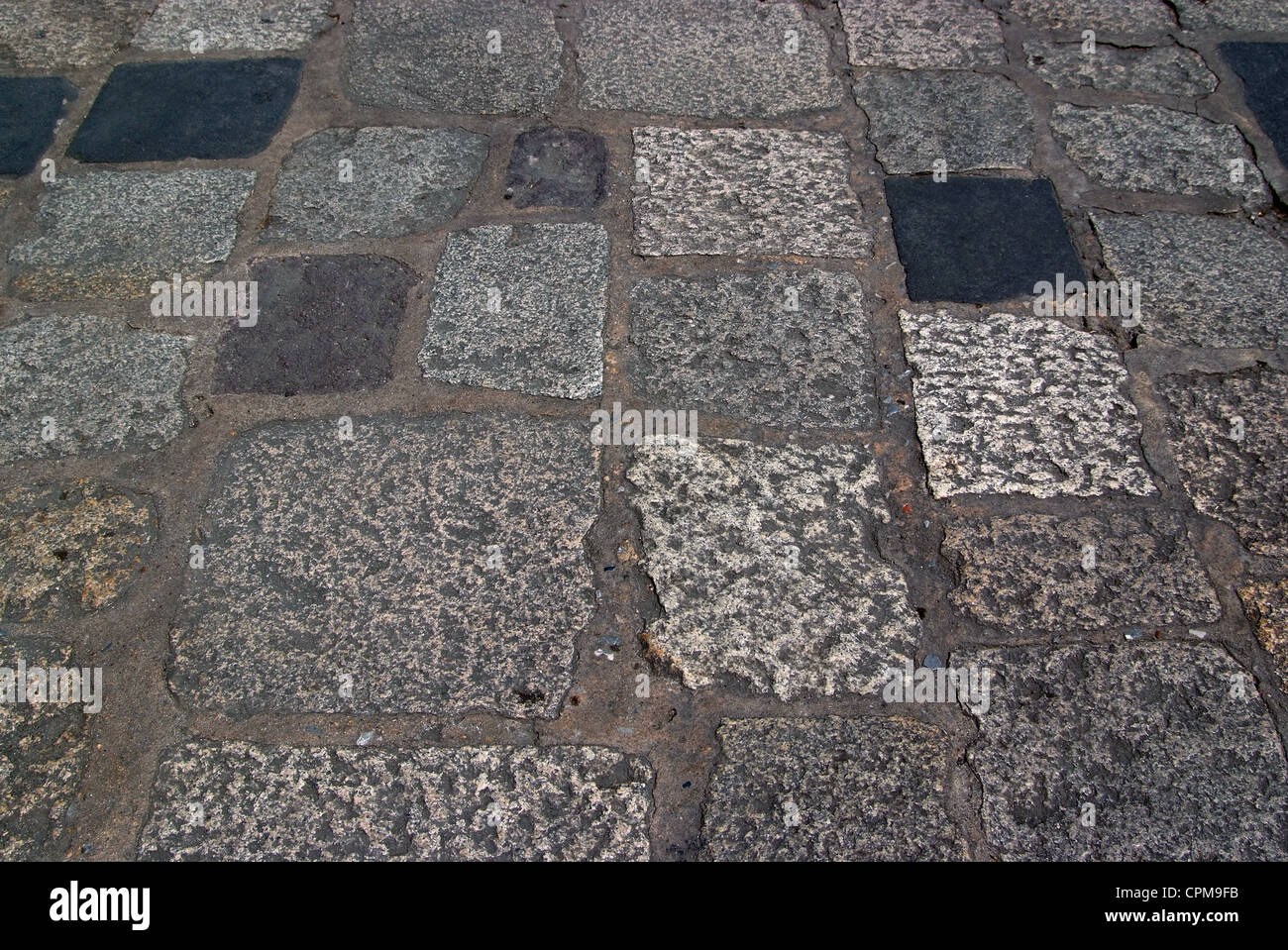 Old road paved with the cobble stones Stock Photo