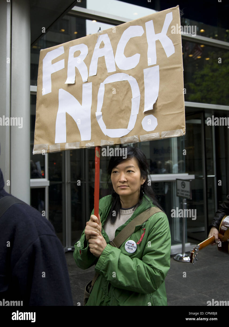 Environmental activists demonstrate in front of Gov. Cuomo's NYC office urging him to ban Fracking in New York State. Stock Photo