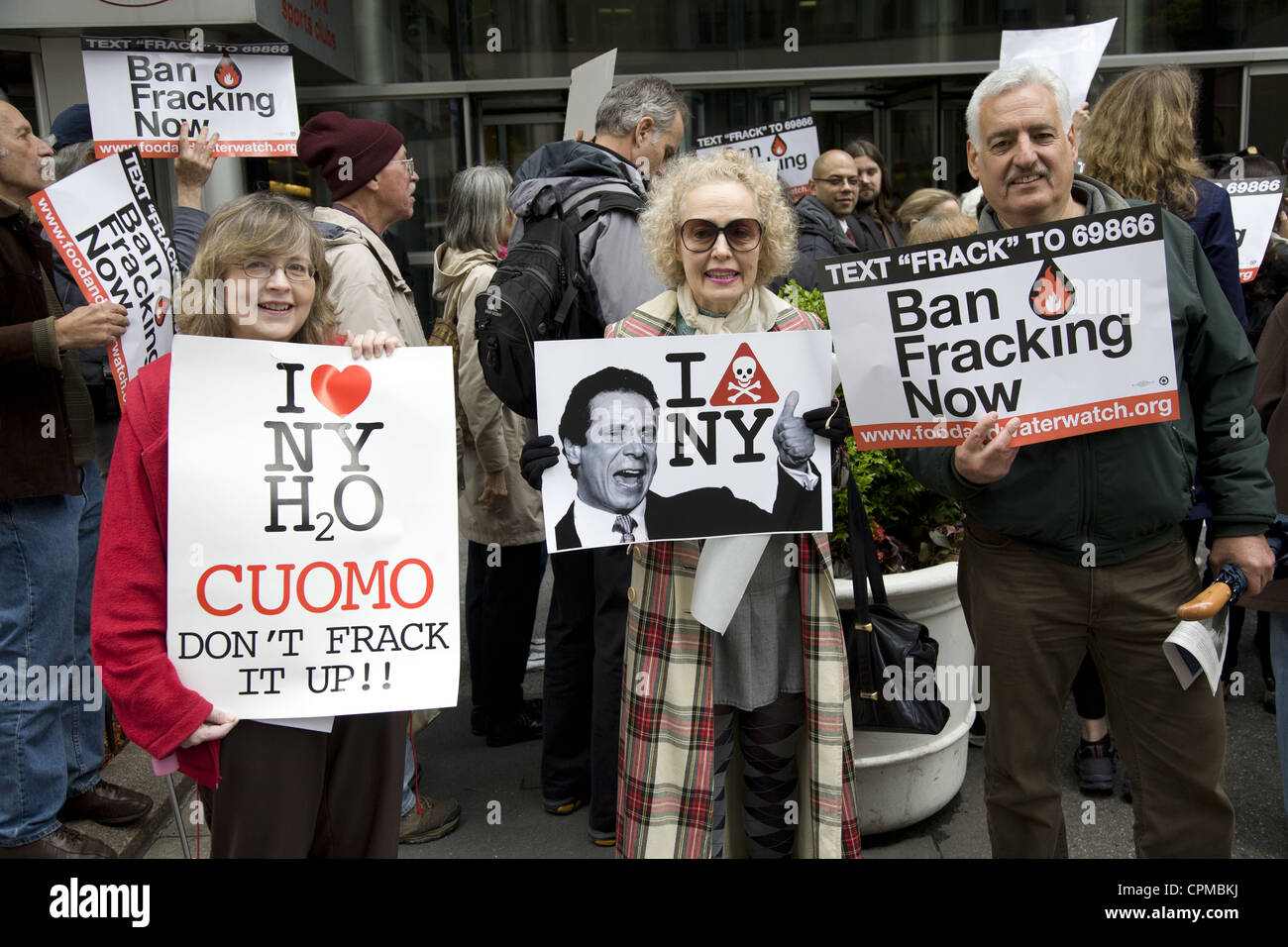 Environmental activists demonstrate in front of Gov. Cuomo's NYC office urging him to ban Fracking in New York State. Stock Photo