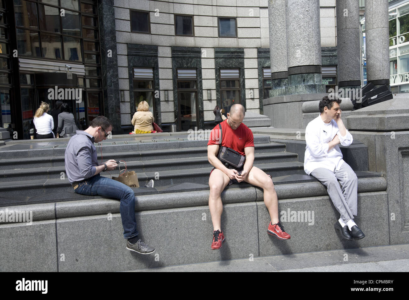 People texting and speaking on their cell phones on Lexington Ave. in ...