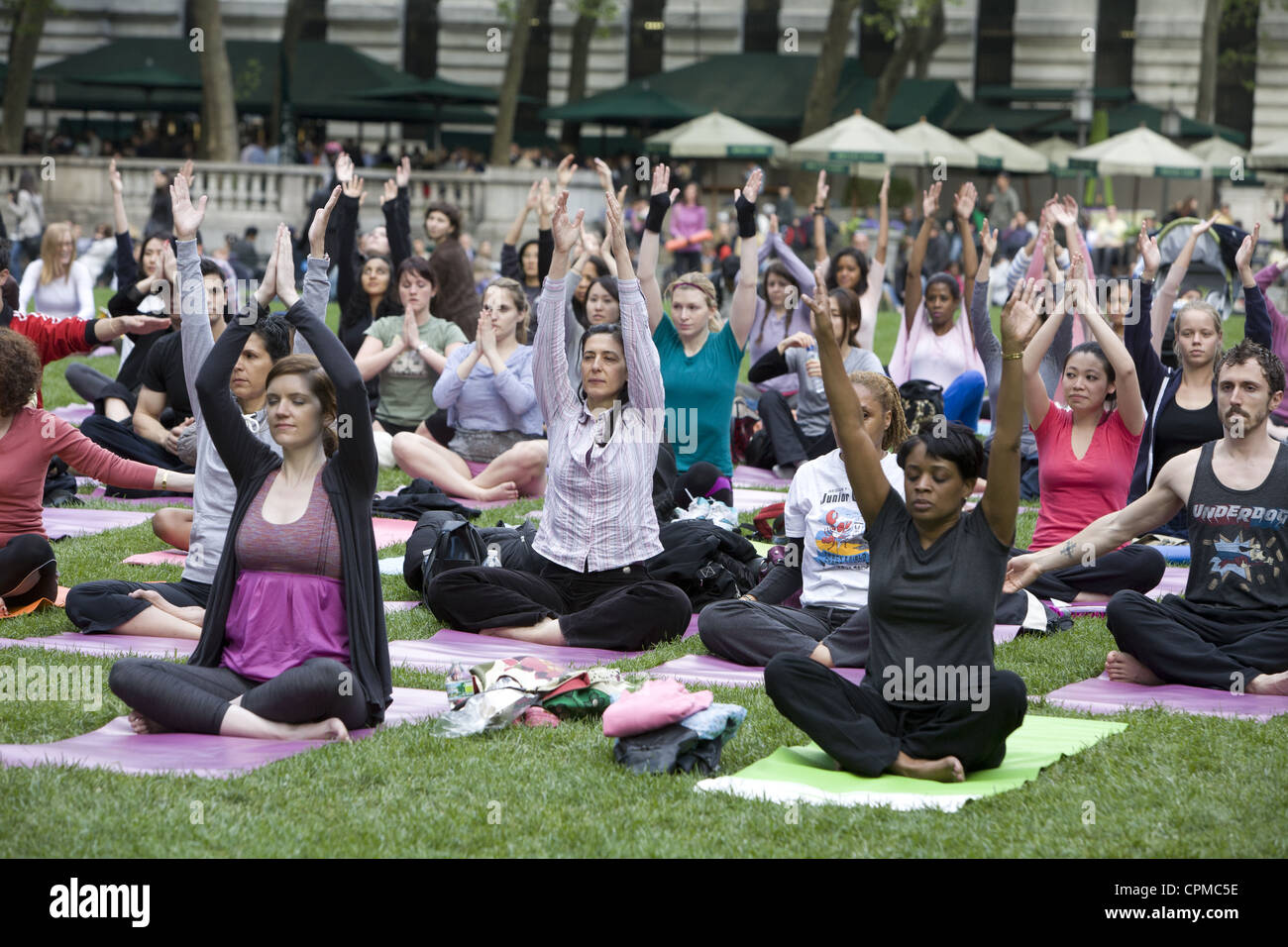 Free yoga classes every week in Bryant Park in Manhattan have very popular Stock Photo