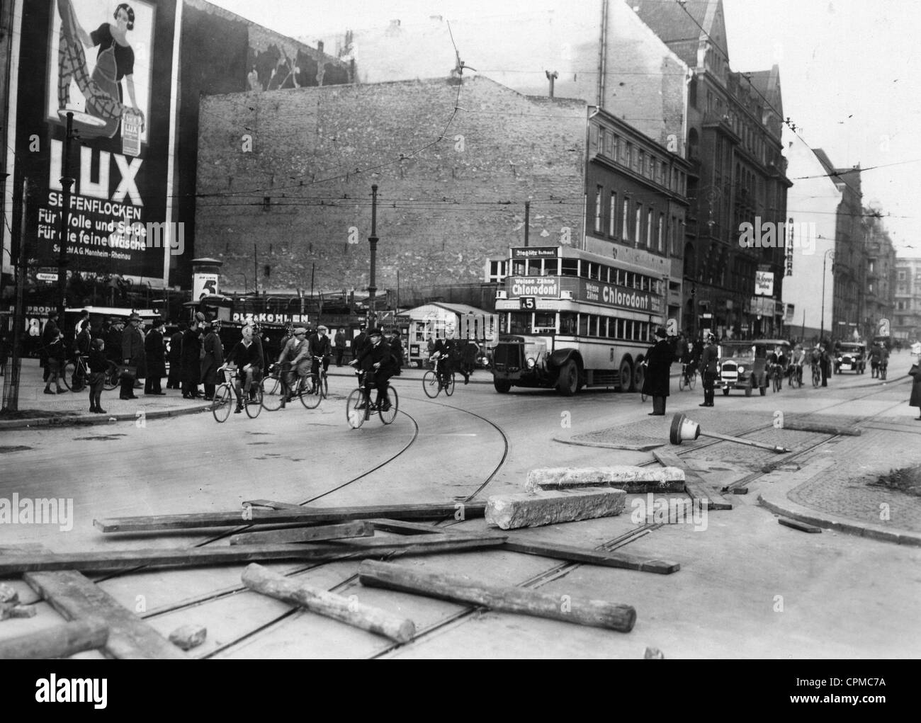 Tram rails are made unpassable with stone posts and wooden planks and beams, during the BVG public transport strikes in Berlin, Stock Photo