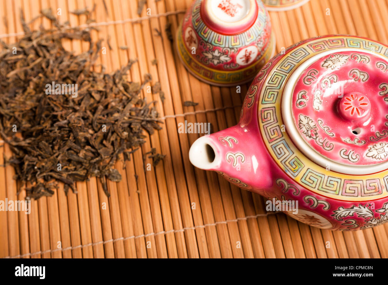 green tea leaves and teapot Stock Photo