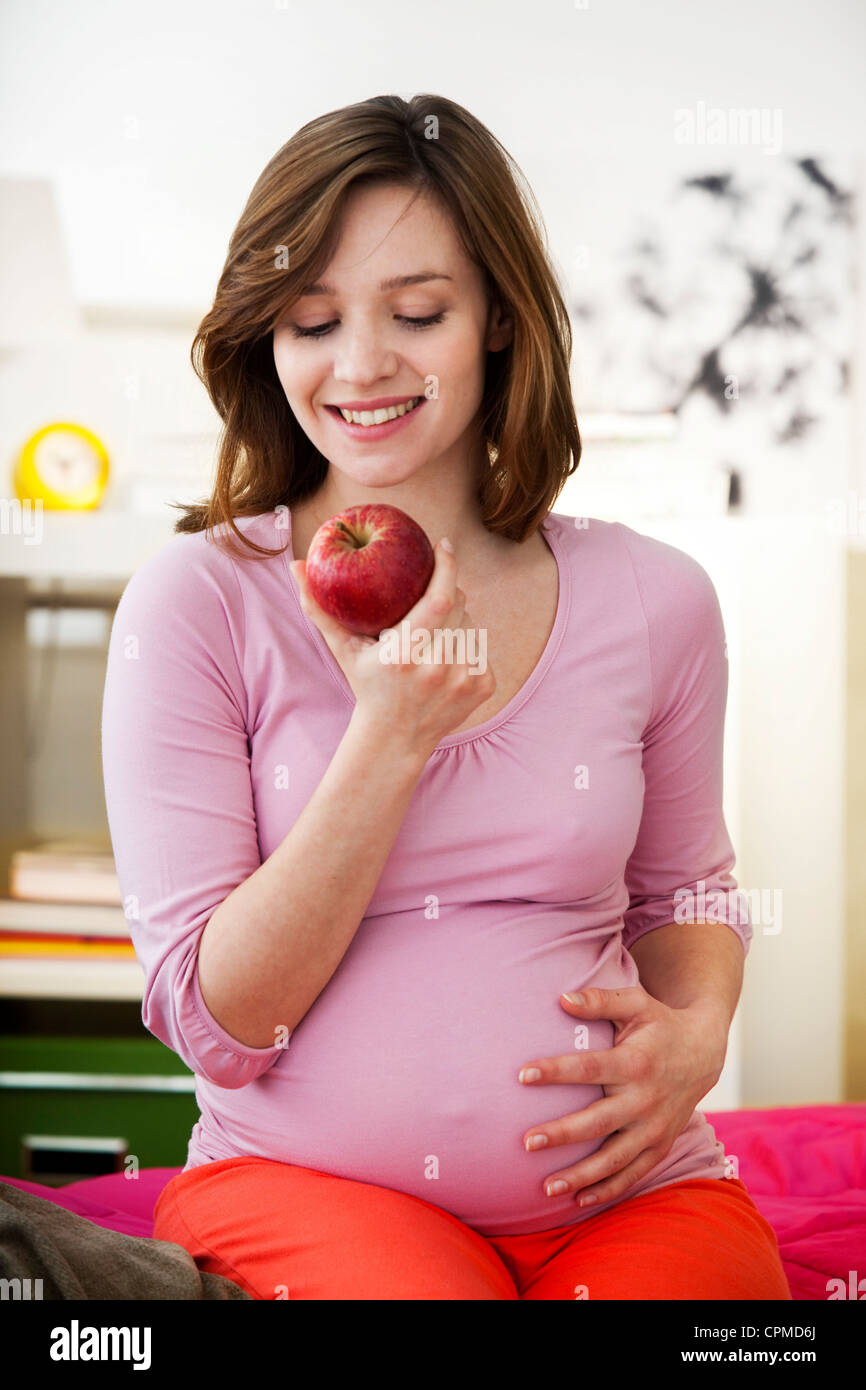 PREGNANT WOMAN EATING Stock Photo