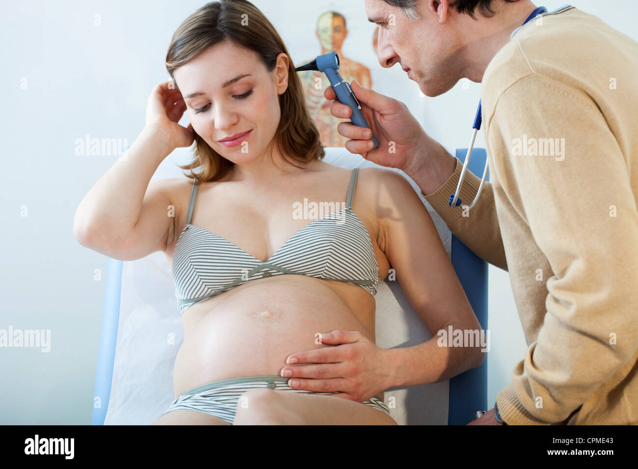 EAR NOSE & THROAT PREGNANT WOMAN Stock Photo