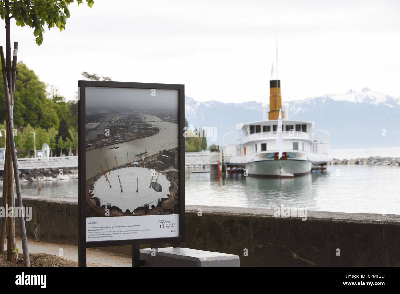 IOC Olympic paddle steamer and poster on Lake Geneva from Ouchy waterfront in Lausanne, Vaud, Switzerland Stock Photo