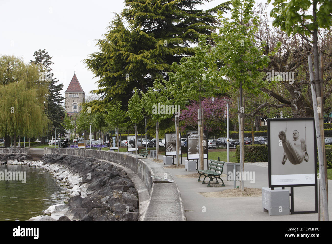 IOC Olympic posters on the edge of Lake Geneva leading to the Chateau de Ouchy in Lausanne, Vaud, Switzerland Stock Photo