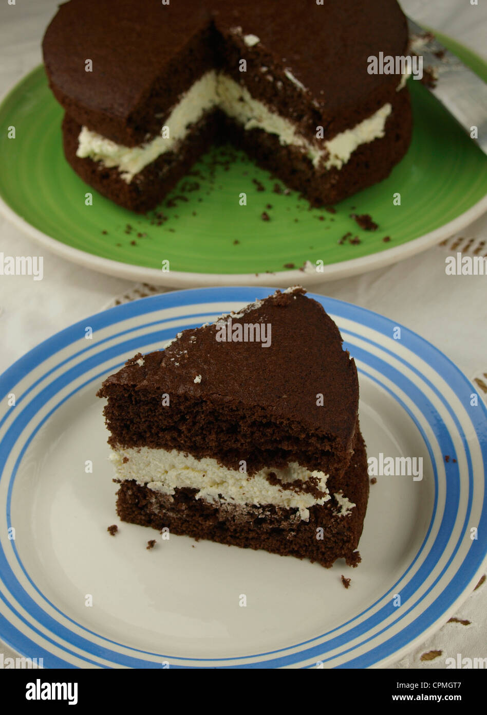 Chocolate sponge cake with fresh cream filling Stock Photo Alamy