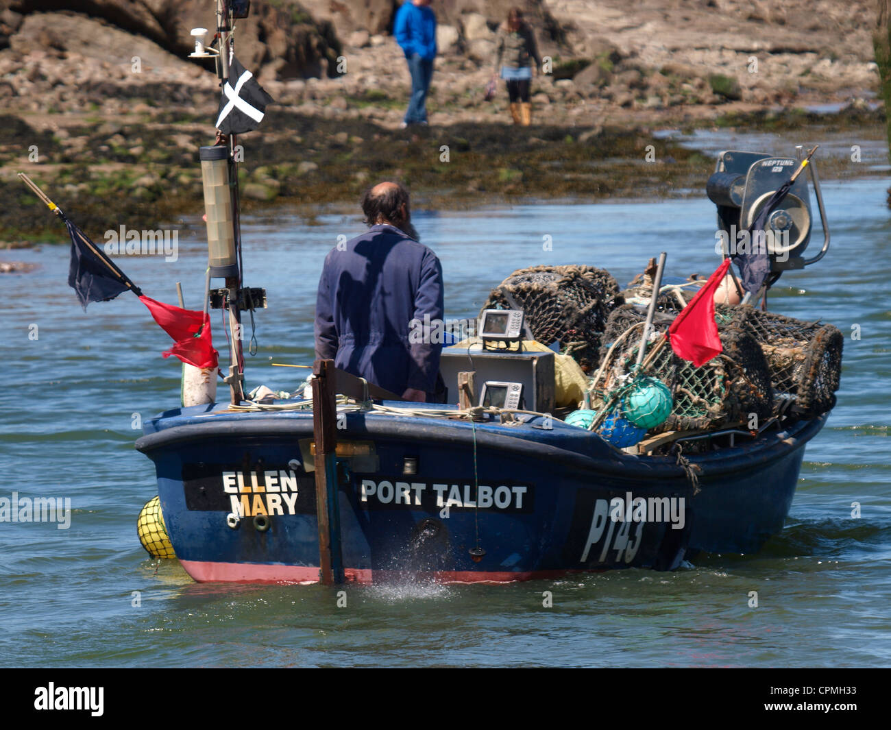 Cornish fisherman heading out to sea, Bude, Cornwall, UK Stock Photo
