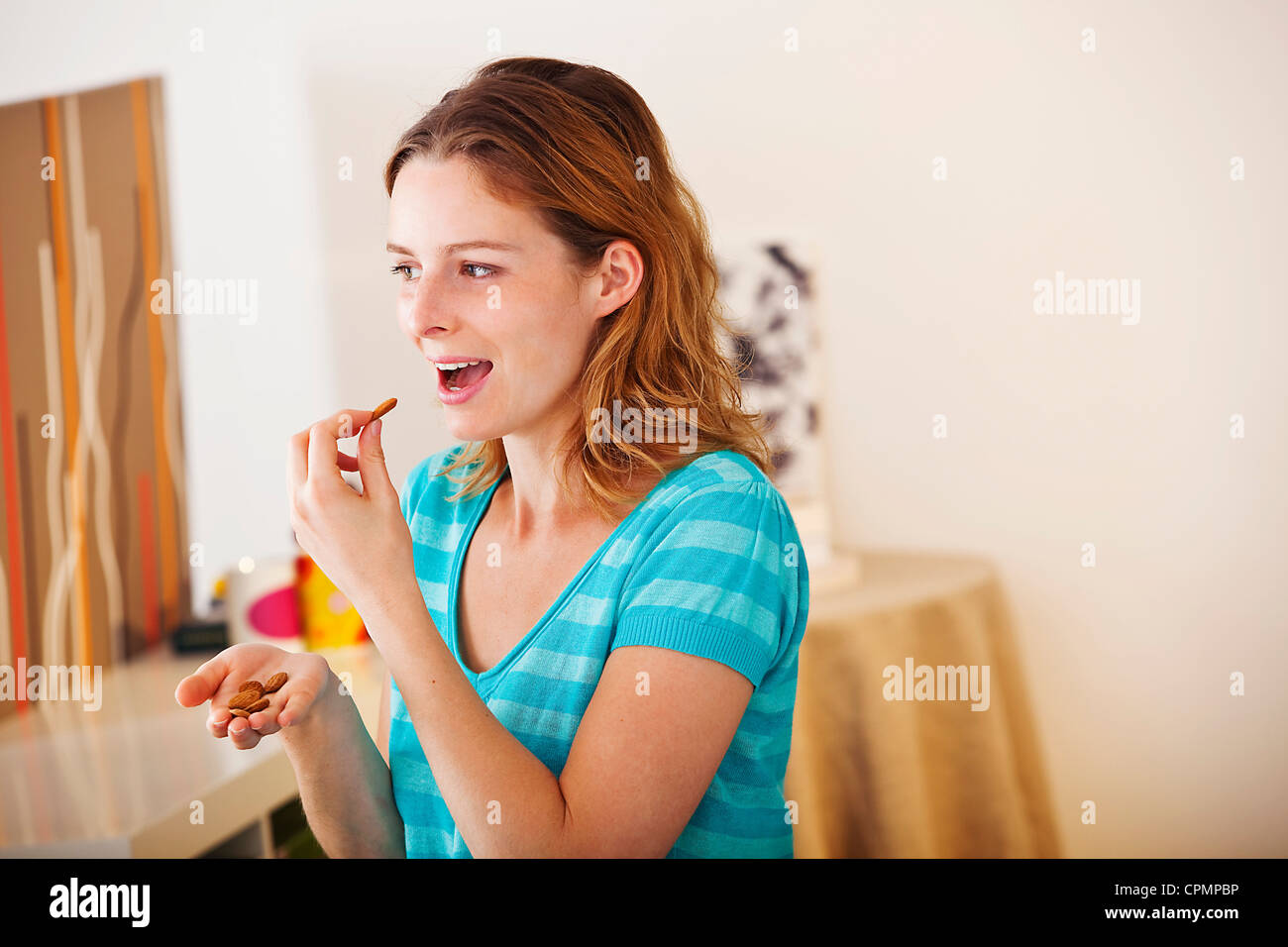 WOMAN EATING DRIED FRUIT Stock Photo Alamy woman-eating-dried-fruit-stock-photo-alamy