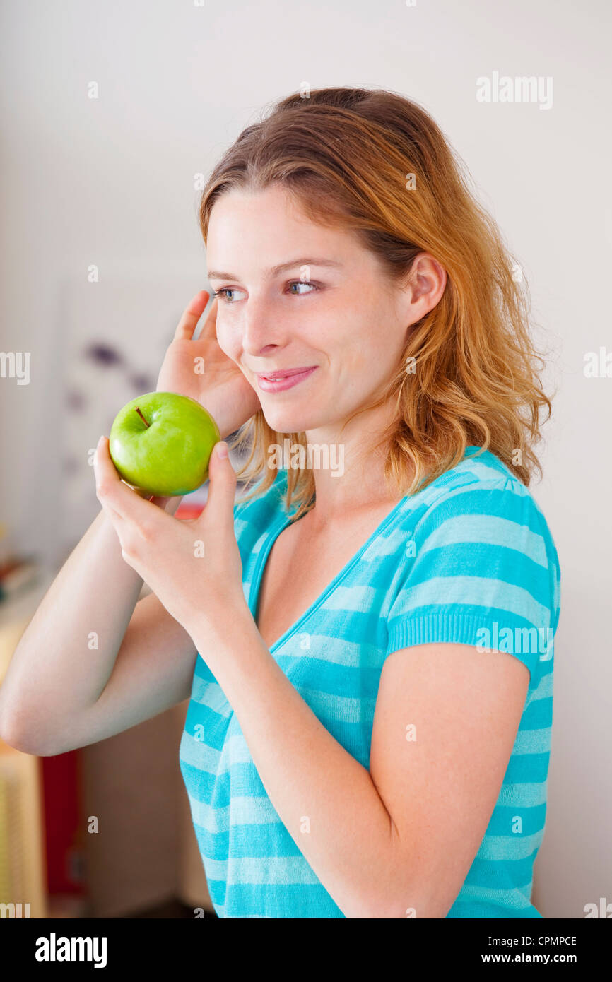 WOMAN EATING FRUIT Stock Photo Alamy