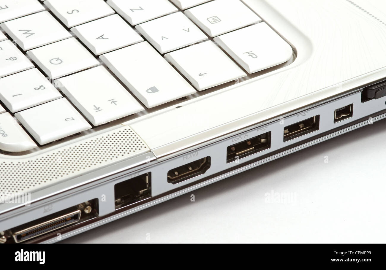 Multiple ports on side of a white notebook Stock Photo