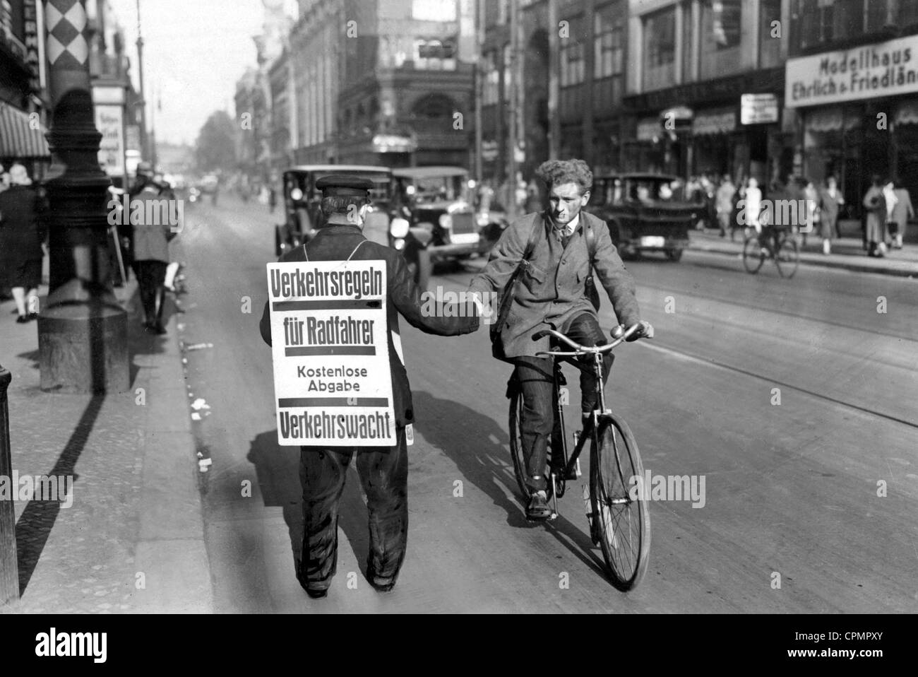Distribution of new traffic laws to cyclists, 1929 Stock Photo Alamy