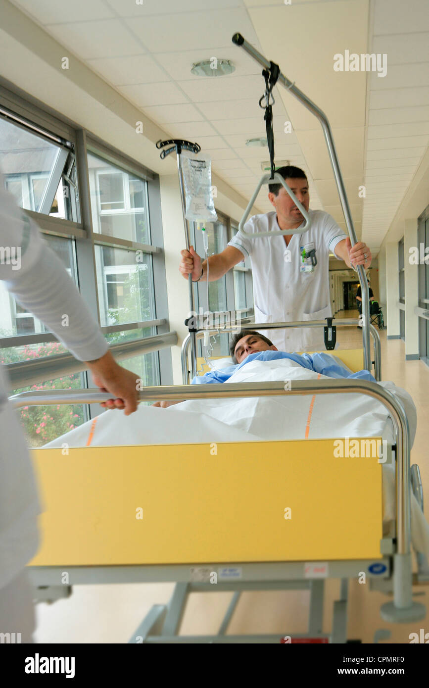 Stretcher bearer with sick person hires stock photography and images