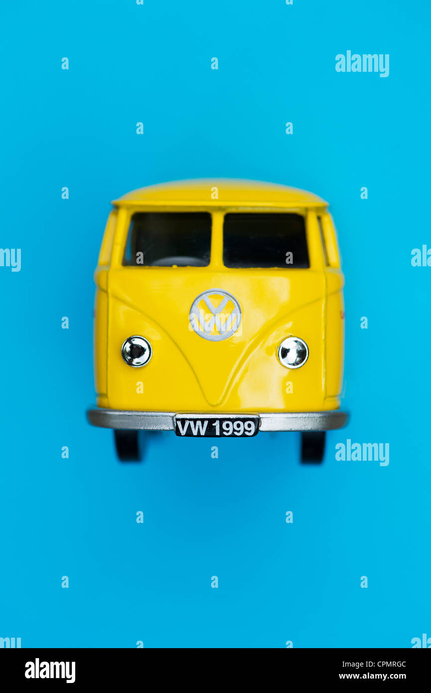 Yellow Matchbox Die cast Volkswagen van on blue background Stock Photo