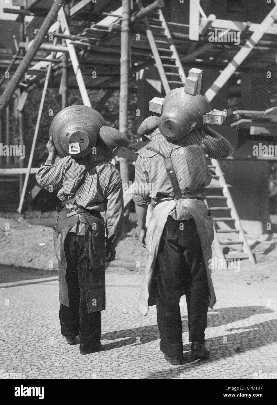 Workers carry bells to the construction site, 1935 Stock Photo