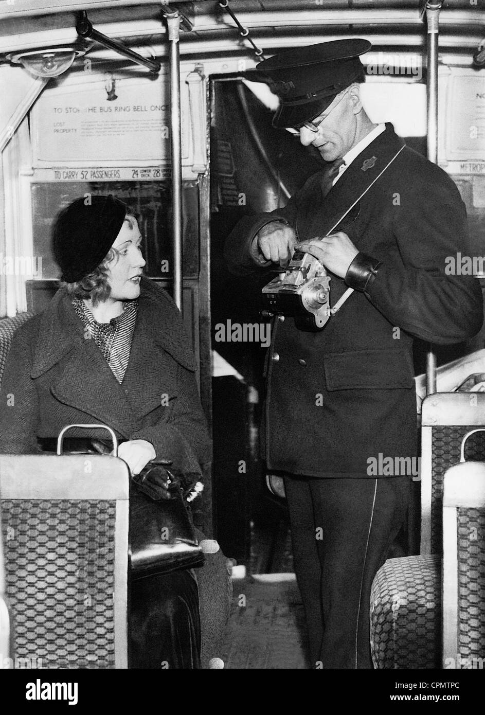 Bus conductor in London, 1933 Stock Photo